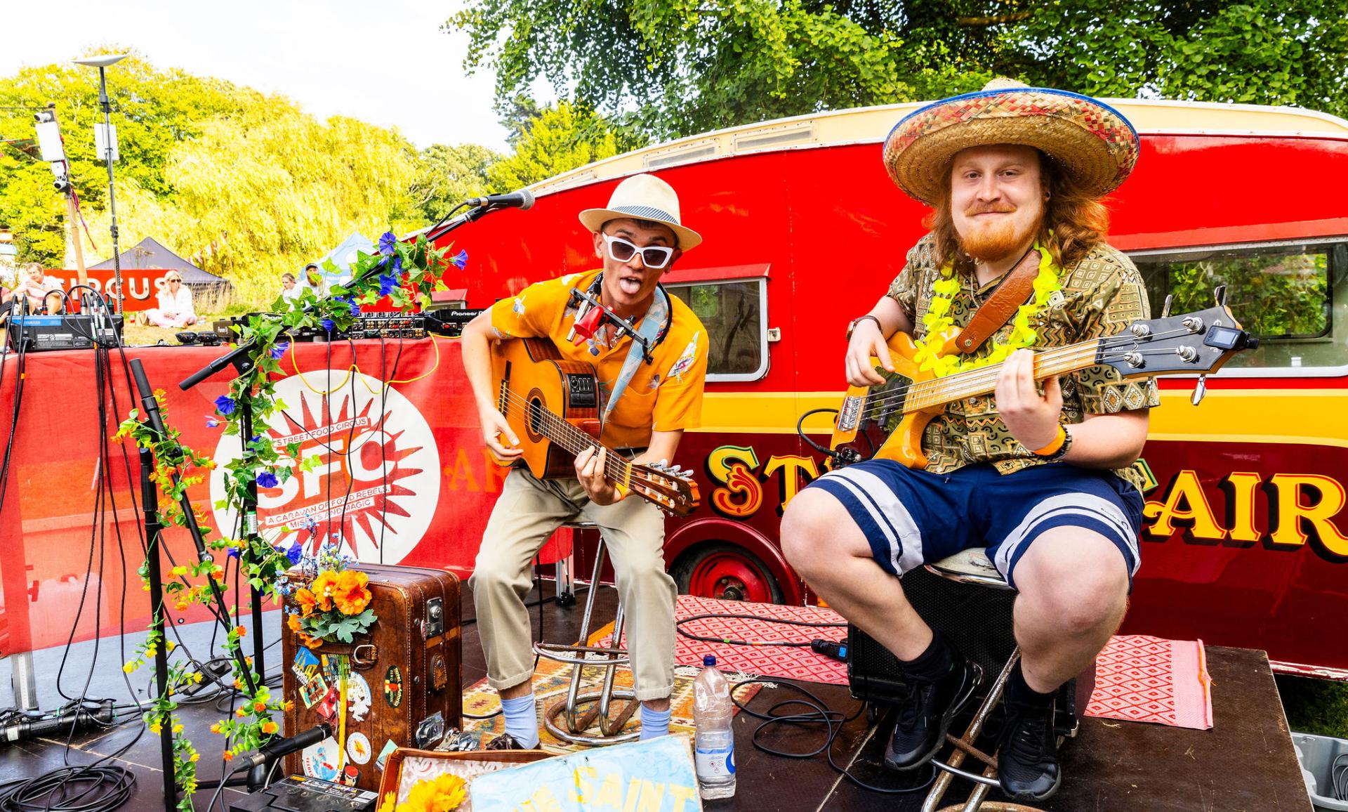 Two men playing guitar