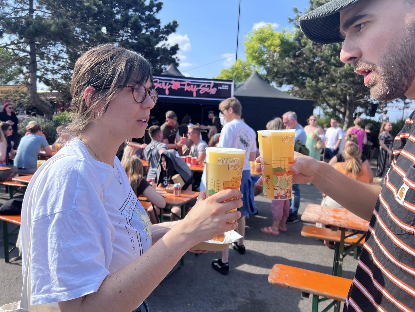 a couple with drinks in their hand